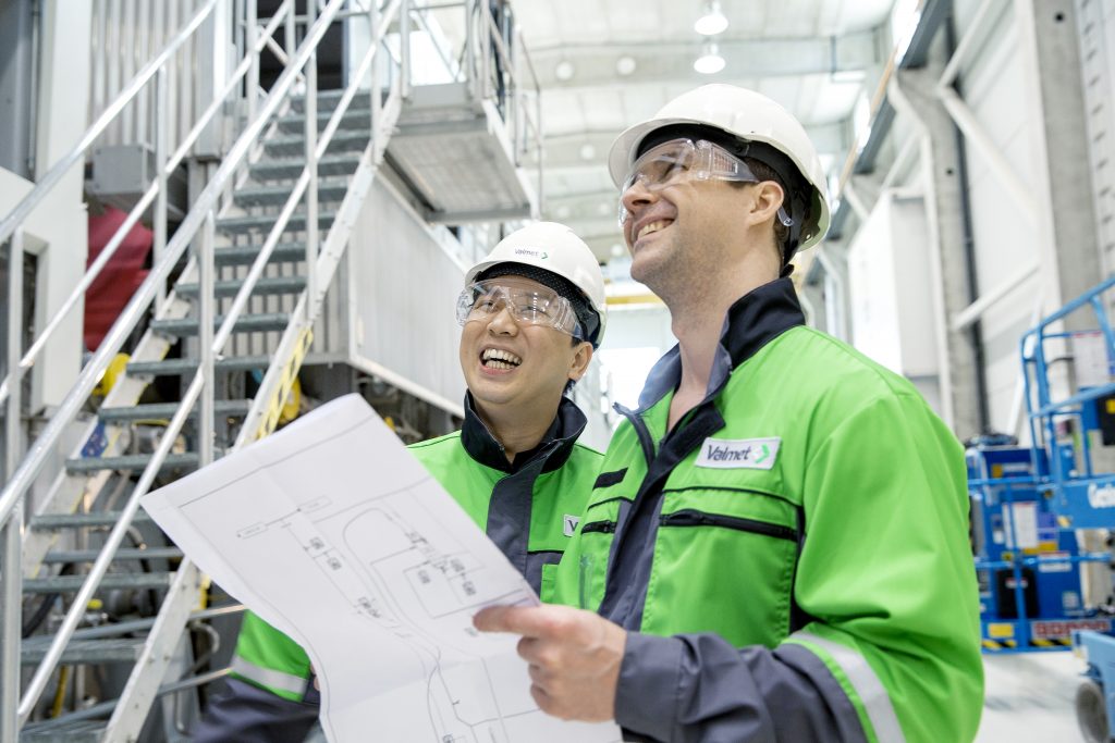 Valmet manufacturing workers at a plant.