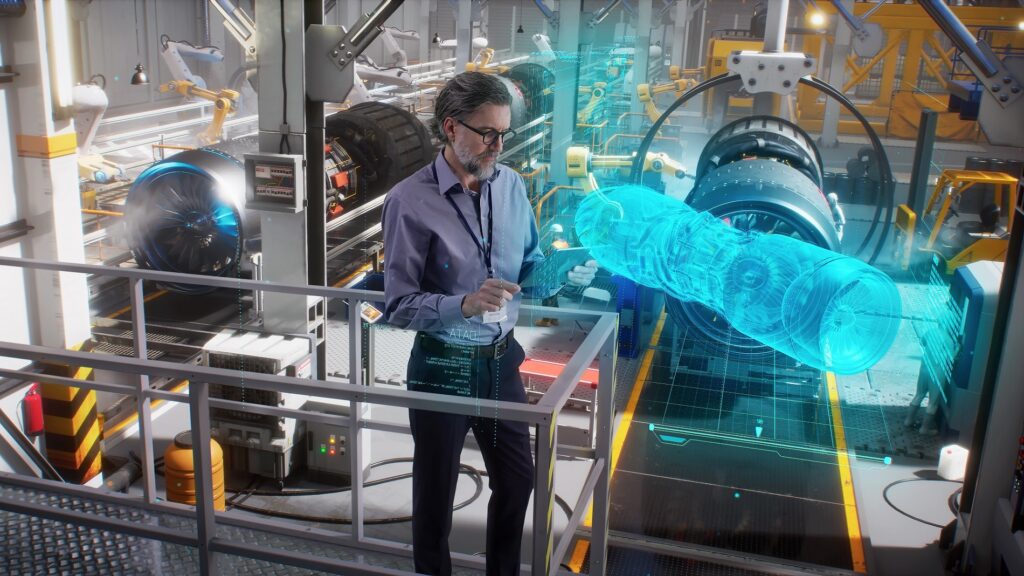 n engineer uses a tablet with a holographic innovative application, to model and design and monitor a 3D model of an aircraft engine while on an automated robotic line at an aerospace factory