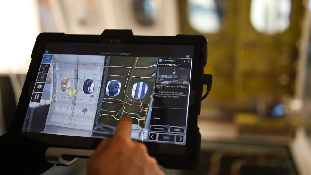 DELMIA augmented reality software on a tablet being used in manufacturing assembly