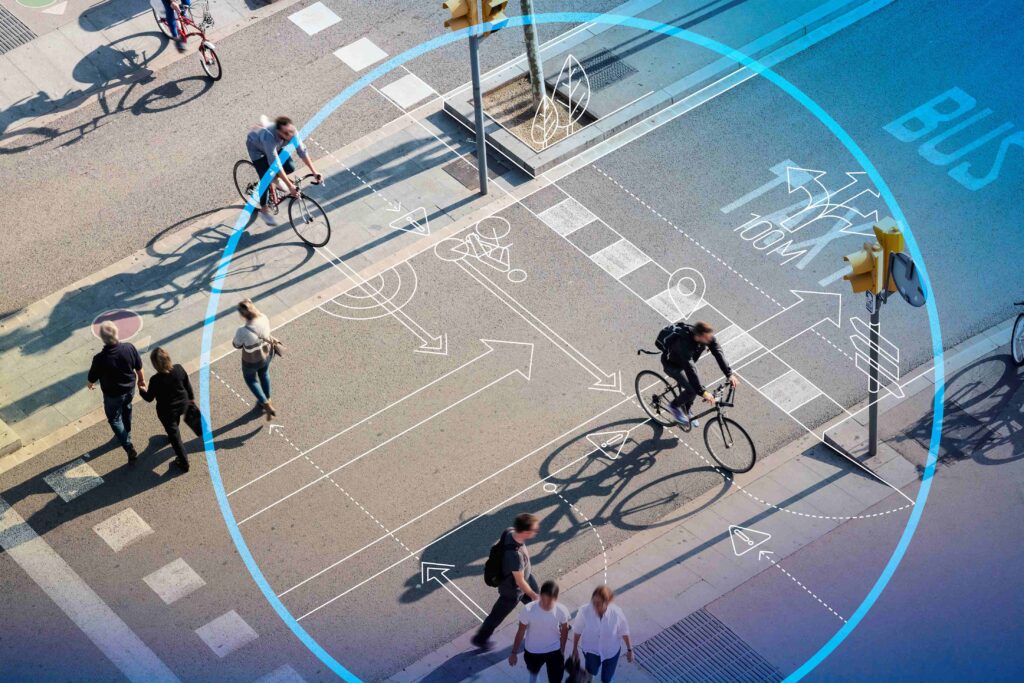 Cyclists and pedestrians share city streets - urban sustainability - Dassault Systemes