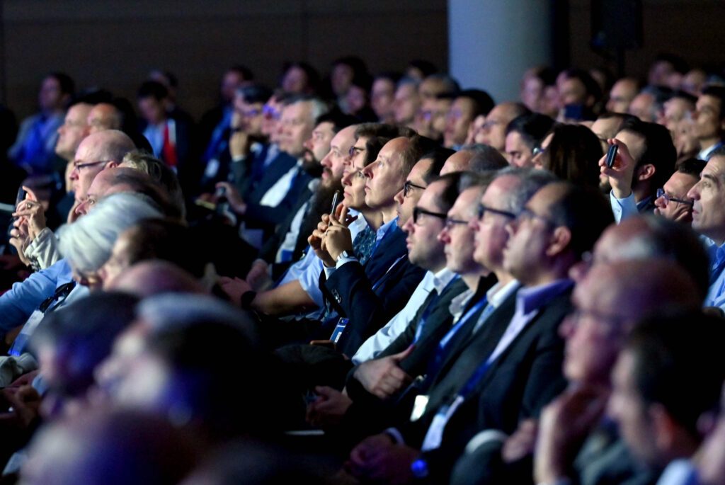 Crowd of seated people looking in the same direction