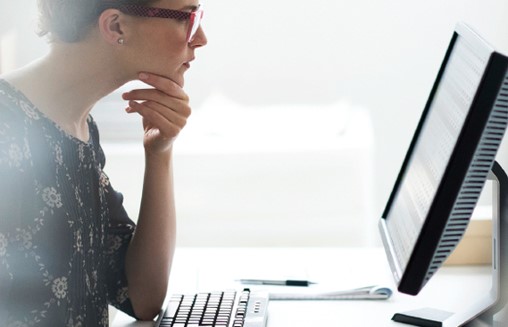 looking at formulation product specifications data on a monitor 