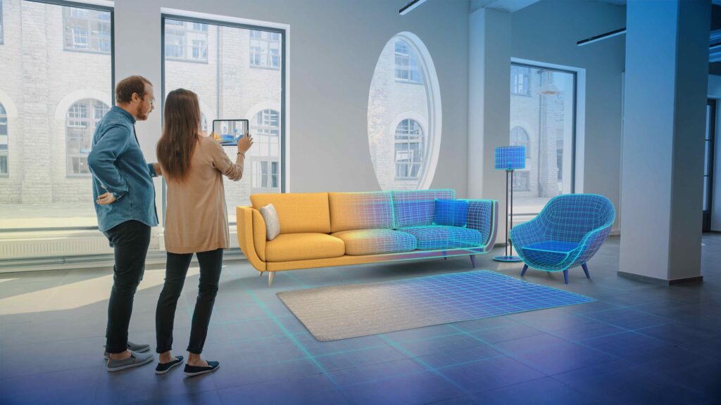 A couple stands in a living room viewing a half-real, half-virtual rendering of furniture - office-tohome - Dassault Systemes blog 