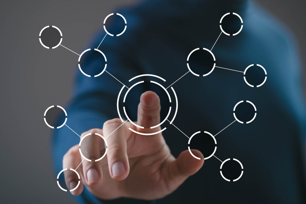Hand touching central node of connected digital network interface. Concept of system integration, data connectivity, network structure, digital ecosystem, technology solution, information management.